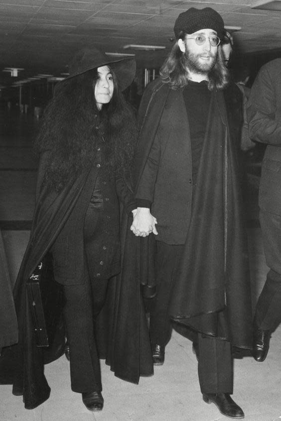 Yoko Ono and John Lennon at London Airport in 1969 (ANL/Shutterstock)