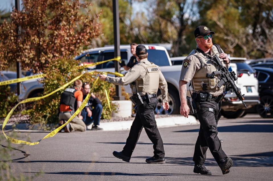 Flathead County Sheriff deputies respond to the scene of a shooting incident in the parking lot of Fuel Fitness in Kalispell, Mont., Thursday, Sept. 16, 2021.