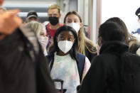 Simone Biles and the U.S. Women's Gymnastics team arrive for the Tokyo 2020 Summer Olympic Games at Narita International Airport Thursday, July 15, 2021, in Narita, east of Tokyo. (AP Photo/Kiichiro Sato)