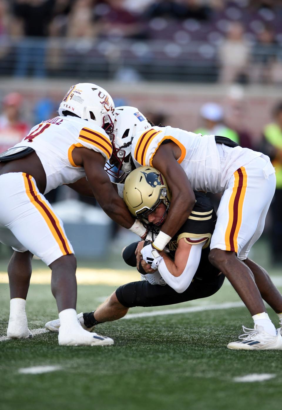 Texas State's Joey Hobert is sandwiched by Louisiana-Monroe defenders during the Bobcats' victory Saturday night. Hobert caught two touchdown passes, including the winner with 41 seconds left.