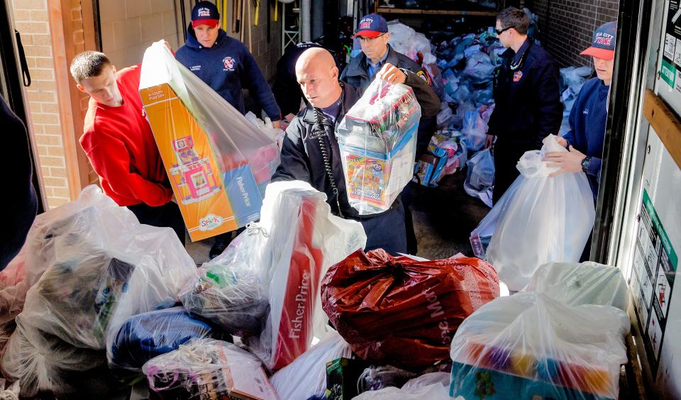 During a previous year, members of Oklahoma City Fire Department Station No. 1 load toys they had bought for 466 foster care children.