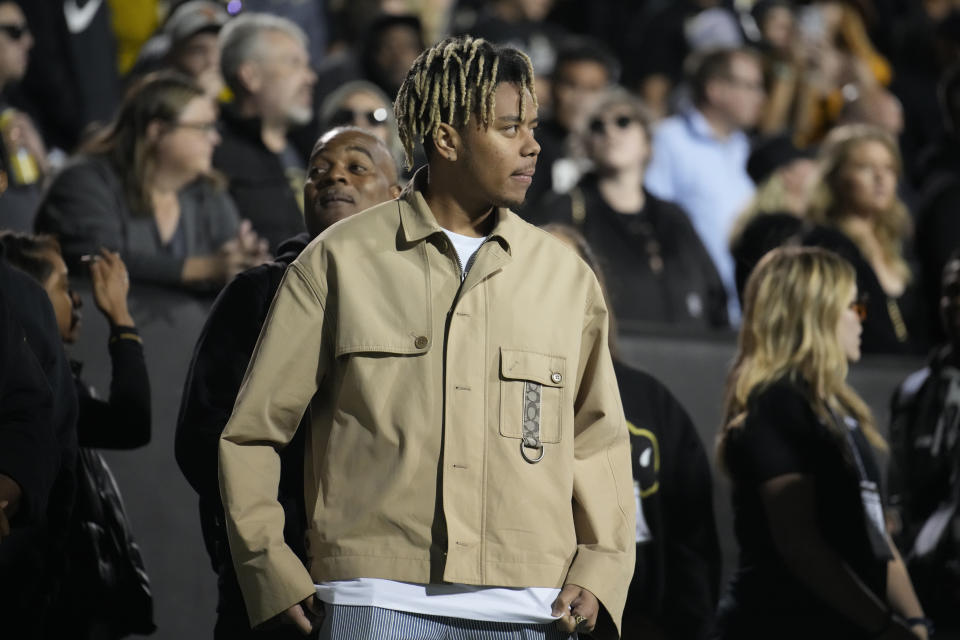 Rap star Cordae looks on from the sidelines in the first overtime of an NCAA college football game between Colorado and Colorado State Saturday, Sept. 16, 2023, in Boulder, Colo. (AP Photo/David Zalubowski)