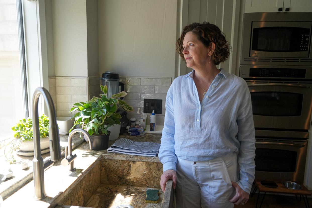 Jill Zinsmeyer, looking out of the window of her Lakeway home, had severe reactions to insect bites, heat and extreme temperature changes after moving to Texas. Doctors diagnosed her with indolent systemic mastocytosis.