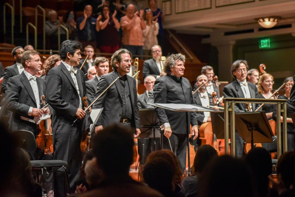 Musician and composer Kip Winger, second from right, stands with the Nashville Symphony’s Music Director Giancarlo Guerrero, right, after the 2017 performance of Winger’s Grammy-nominated “Conversations With Nijinsky.” The 2024-25 season will be Guerrero's last season with the Nashville Symphony.