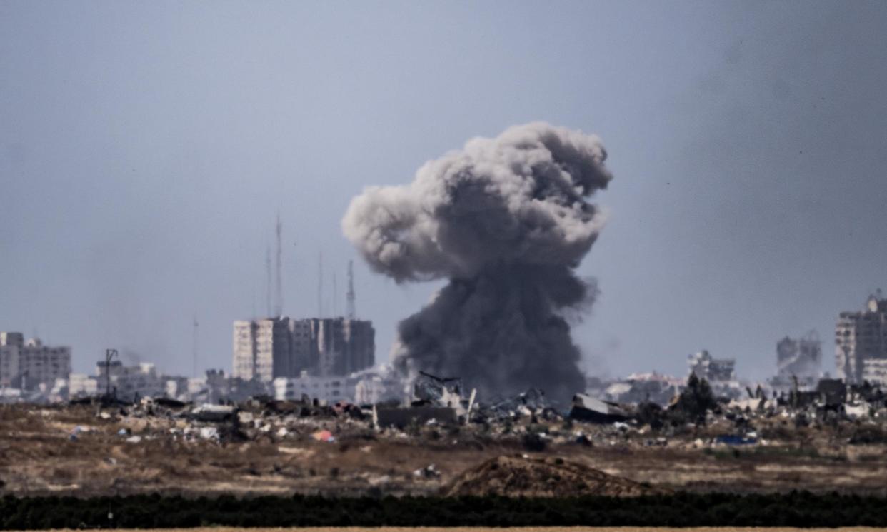 <span>Smoke rises as the Israeli army attacks the north of Gaza, as seen from the Kfar Aza region of Israel on 12 May.</span><span>Photograph: Anadolu/Getty Images</span>