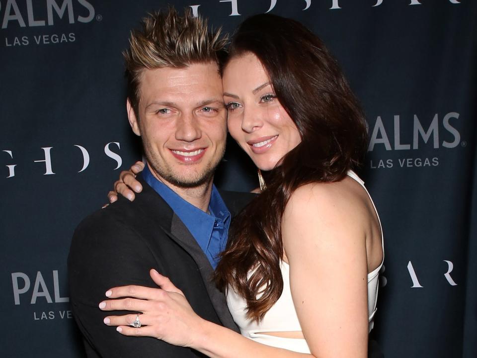 Nick Carter (L) of Backstreet Boys and his fiancee Lauren Kitt arrive to celebrate their coed bachelor and bachelorette party at Ghostbar at the Palms Casino Resort on February 8, 2014 in Las Vegas, Nevada