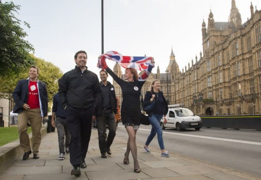 Vote Leave supporters celebrate as they walk through Parliament Square in London on June 24, 2016. (Photo: Anthony Devlin/PA via AP)