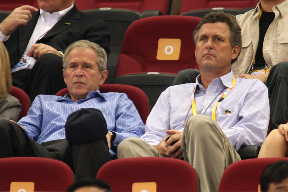 U.S. President George W. Bush and brother Marvin Bush watch a basketball game at the Summer Olympics on August 9, 2008 in Beijing, China.  (Photo by Mark Dadswell/Getty Images)  -- Son of George H.W. Bush & Barbara Bush -- Brother of George W. Bush, Jeb Bush, Pauline Robinson Bush, Neil Bush, Dorothy Bush Koch 