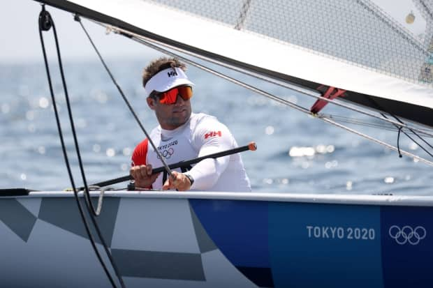 Canadian Tom Ramshaw of Team Canada prepares on the water to compete in the men's finn class races on Saturday in Fujisawa, Kanagawa, Japan. (Phil Walter/Getty Images - image credit)