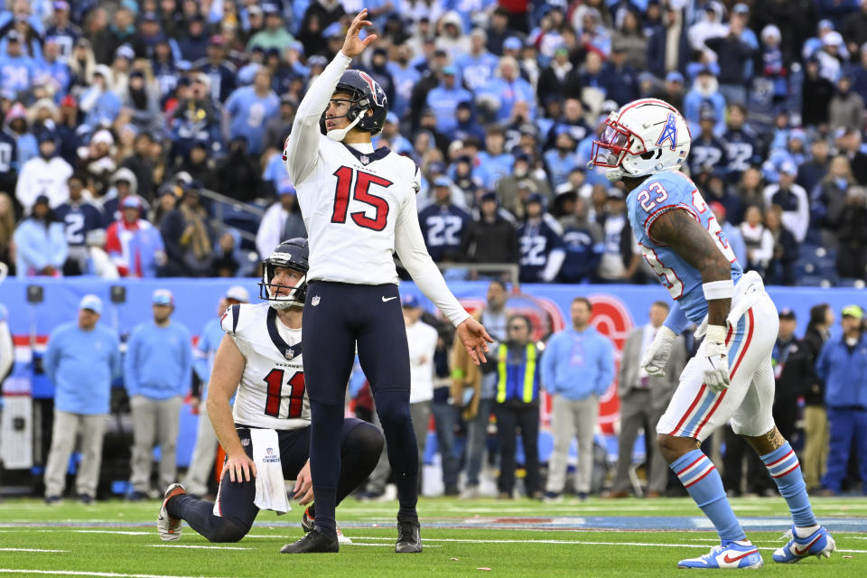 Houston Texans place kicker Ka'imi Fairbairn (15) watches his game-winning field goal during overtime of an NFL football game against the Tennessee Titans, Sunday, Dec. 17, 2023, in Nashville, Tenn. (AP Photo/John Amis)