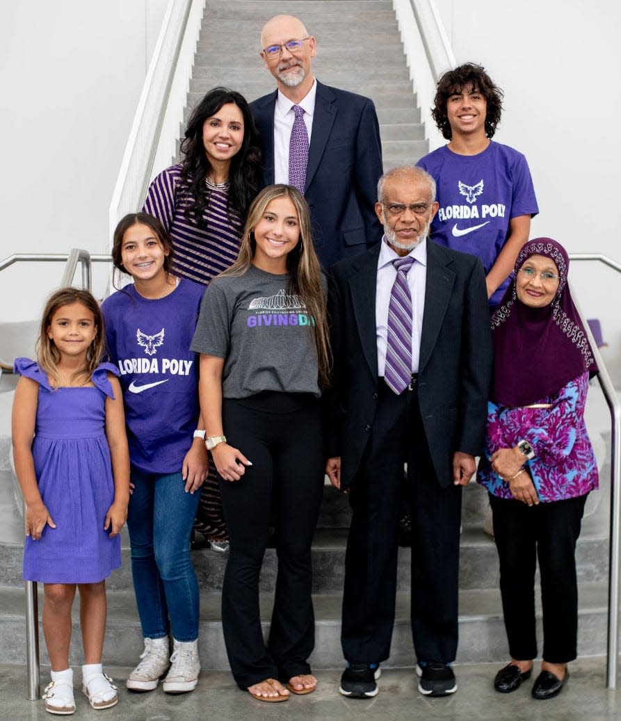 Florida Polytechnic University professor Muhammad Rashid, second from right in front row, is shown with family members. He and his wife, Fatema Rashid, have donated $500,000 to created the school’s first endowed chair.