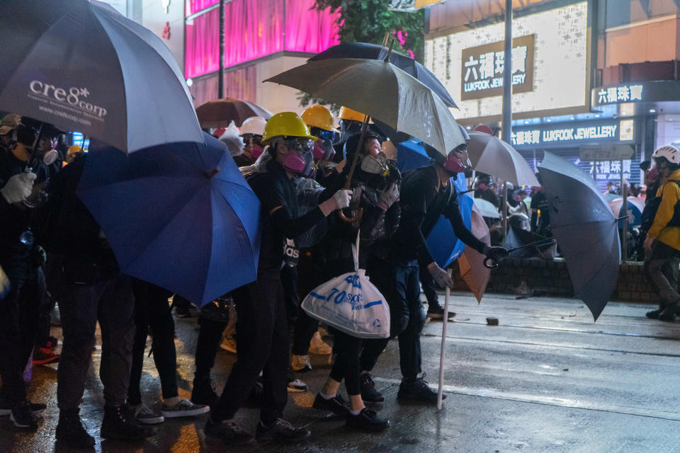 Protesters hold umbrellas to protect themselves from police attack in Hong Kong on Aug. 31, 2019. | Alda Tsang/SOPA Images/LightRocket via Getty Images