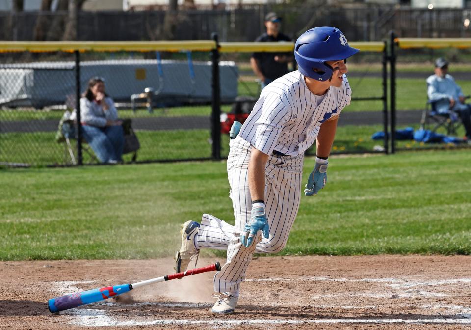 Adrian's Tristan Hayes gets a hit during Tuesday's game against Chelsea.