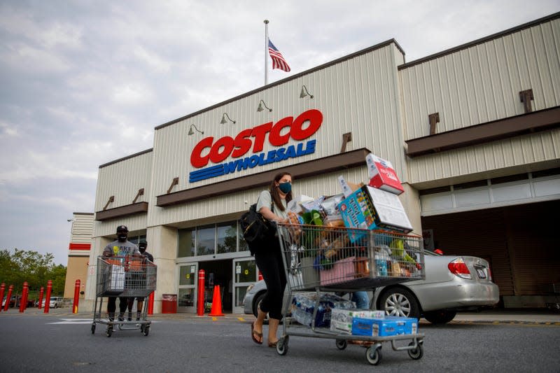 Shoppers exit a Costco in Washington, DC - Image: Ting Shen/Xinhua (Getty Images)