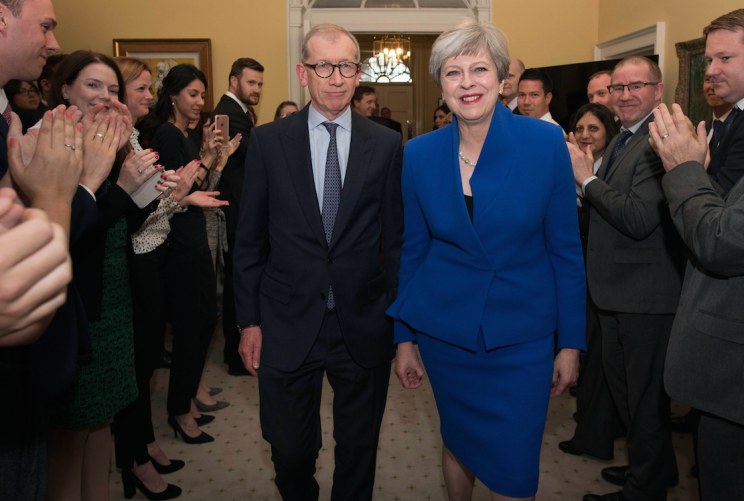 Mrs May and her husband Philip put a brave face on things during their return to Number 10 (Picture: PA)