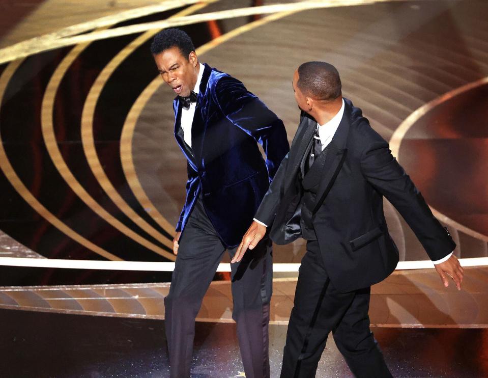 HOLLYWOOD, CA - March 27, 2022. Chris Rock and Will Smith onstage during the show at the 94th Academy Awards at the Dolby Theatre at Ovation Hollywood on Sunday, March 27, 2022. (Myung Chun / Los Angeles Times via Getty Images)