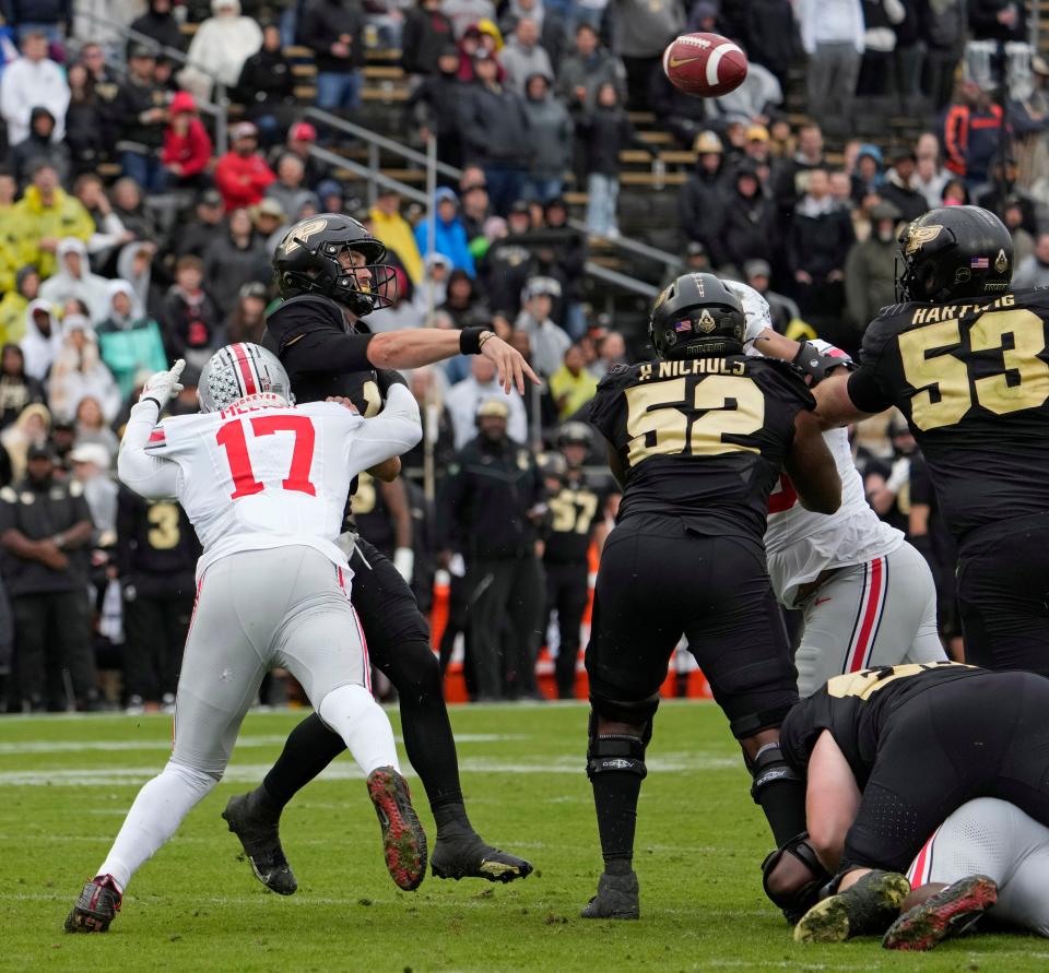 Oct. 14, 2023; Lafayette, In., USA; 
Purdue Boilermakers quarterback Hudson Card (1) is hit by Ohio State Buckeyes linebacker Mitchell Melton (17) during the second half of Saturday's NCAA Division I football game at Ross-Ade Stadium in Lafayette.