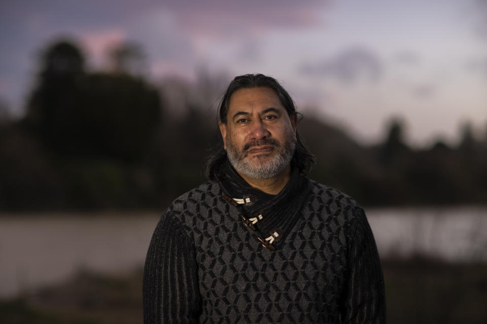 Geoff Hipango, who manages mental health and addiction services for a tribal provider in Whanganui and who lives in a Maori marae community, stands for a portrait on the banks of the Whanganui River in New Zealand on June 15, 2022. He says its been a privilege to see the river gain personhood status after all the hard work of his elders, who never surrendered their beliefs. “Really it was only embodying what our people have always acknowledged and lived by,” he says. “It’s just that the law caught up.” (AP Photo/Brett Phibbs)
