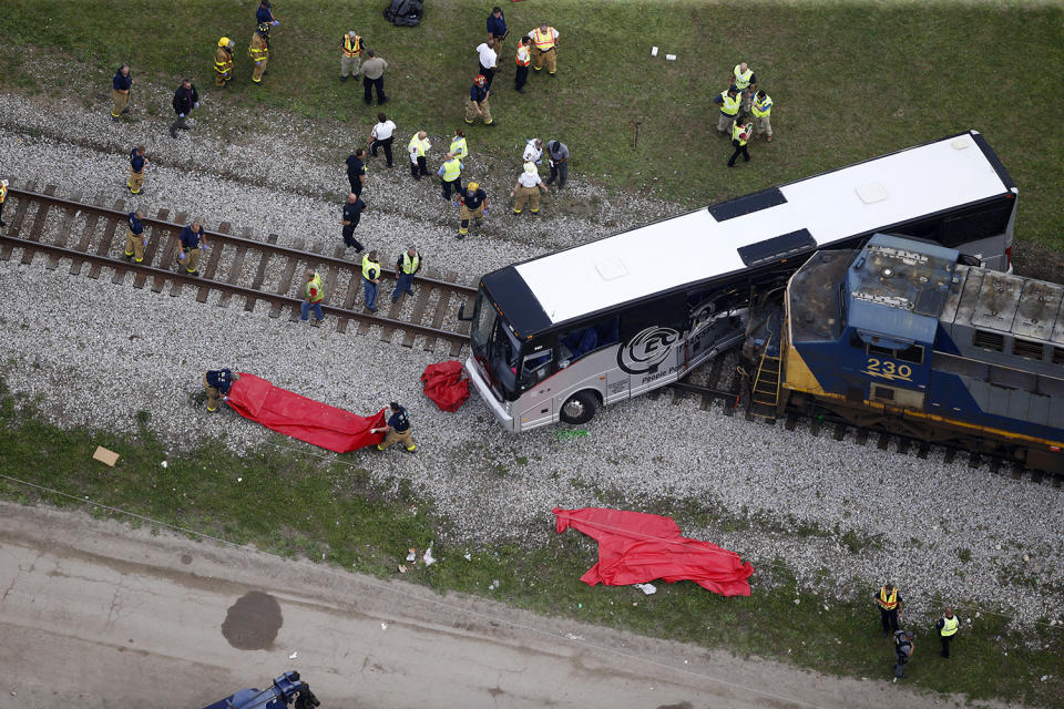 Train hits bus, killing 4