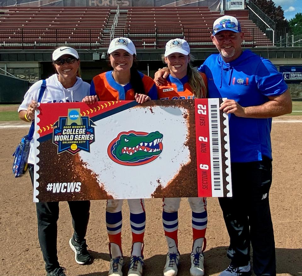 Liz and T.J. Goelz pose with their daughters Kinsey and Avery on Sunday evening after the University of Florida softball team punched its ticket to the Women's College World Series in Oklahoma. Saturday, T.J.'s Lakewood Ranch High softball team won its second straight state title in Clermont.