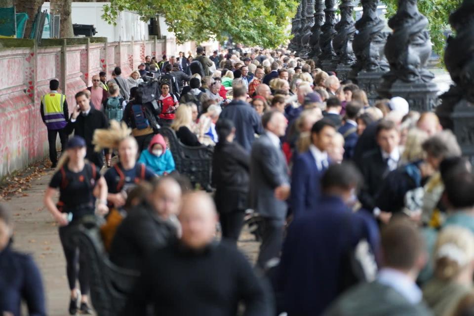 Members of the public join the queue on the South Bank (James Manning/PA) (PA Wire)