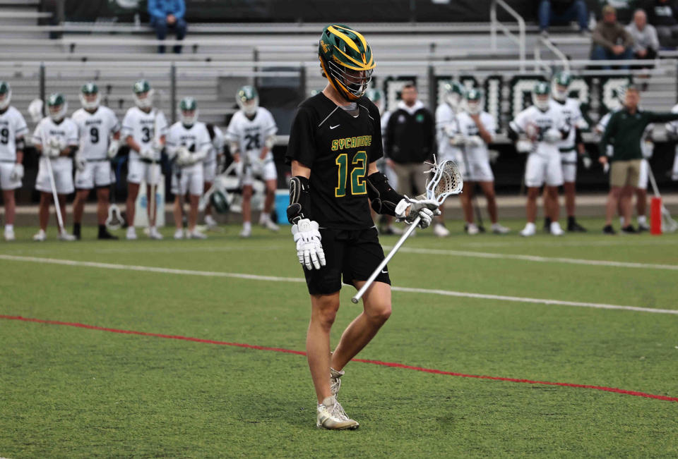 Sycamore's Ryan Lynn (12) eyes the action during the lacrosse game against Mason Tuesday, April 9, 2024.