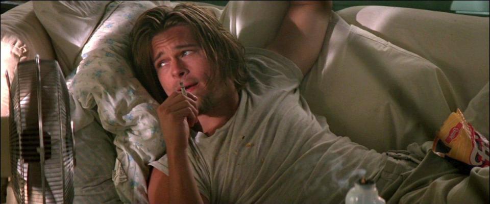 <p>A minor but memorable role one year before his major breakout in <em>Interview With A Vampire</em>, Tarantino-scripted crime comedy <em>True Romance</em> showcased Pitt's ability to make even a pot-smoking couch potato look cool. 'Floyd' wore a grey t-shirt on baggy grey track pants (both matched his sofa) and the kind of long hair and goatee-combo today's <a rel="nofollow noopener" href="https://www.esquire.com/uk/style/a22743156/summer-of-sleaze-2018/" target="_blank" data-ylk="slk:sleezecore wannabes;elm:context_link;itc:0;sec:content-canvas" class="link ">sleezecore wannabes</a> could only dream of.</p>