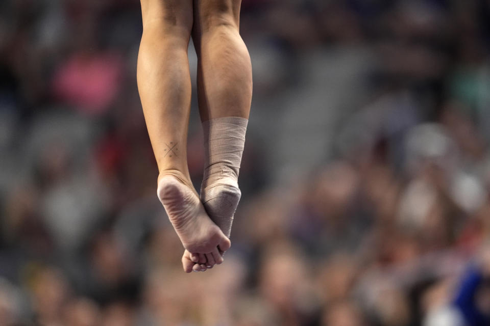 LSU's Savannah Schoenherr competes on the vault during the NCAA women's gymnastics championships in Fort Worth, Texas, Thursday, April 18, 2024. (AP Photo/Tony Gutierrez)