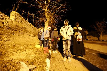 Residents who say they have received permission from the Syrian government to leave the besieged town wait to depart after an aid convoy entered Madaya, Syria January 11, 2016. REUTERS/Omar Sanadiki