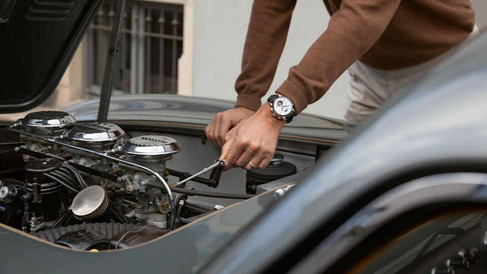 A Man Wearing A. Lange & Söhne Tunes an Engine at the Concorzo d'Eleganza Villa d'Este