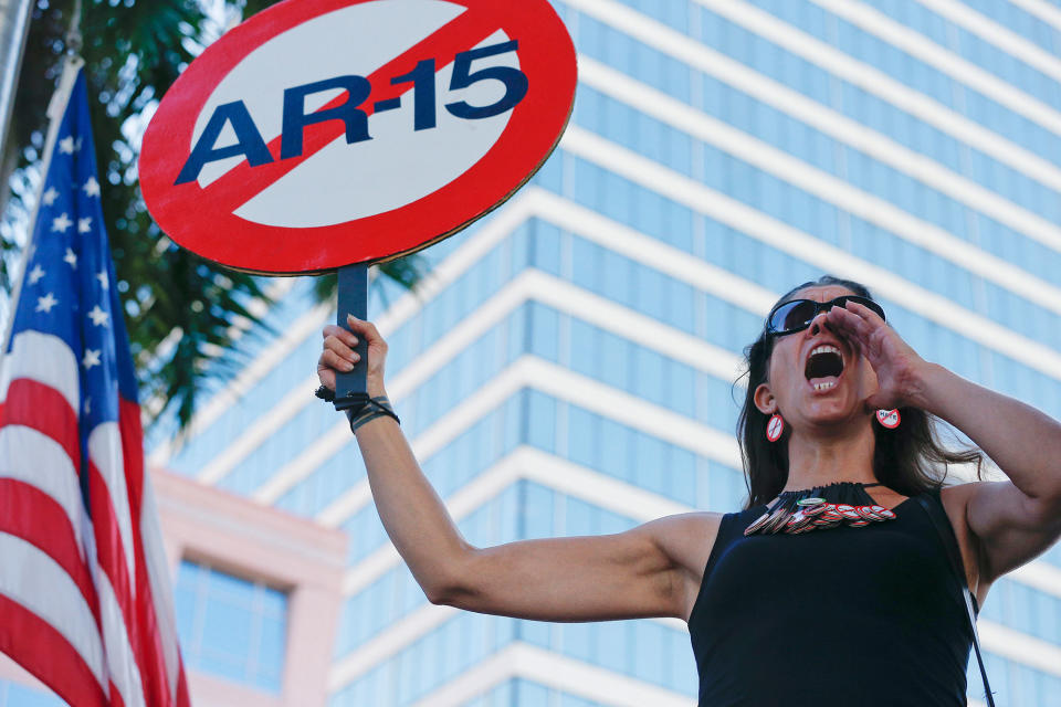 <p>Alessandra Mondolfi holds a sign against AR-15 weapons as she yells, “No More” during a protest against guns on the steps of the Broward County Federal courthouse in Fort Lauderdale, Fla., on Saturday, Feb. 17, 2018. (Photo: Brynn Anderson/AP) </p>