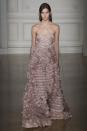 <p>Individual pieces of small disc size silks were hand sewn together to make this dusty pink gown (Photo: Getty Images) </p>