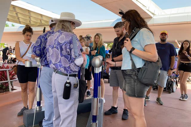 <p>AP Photo/Ted Shaffrey</p> Disney guests using electronic tickets to enter Epcot.