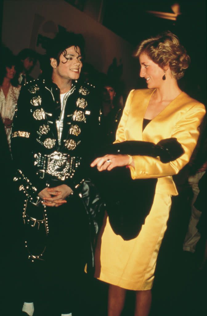 <p>Princess Diana's yellow satin suit stole the show next to Michael Jackson's gold and black jumpsuit at the singer's concert for the Prince's Trust. </p>