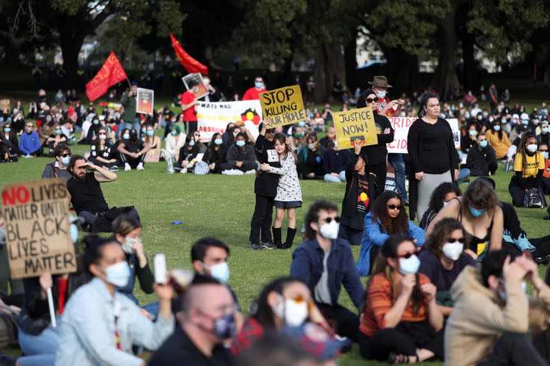 People demonstrate in solidarity with the Black Lives Matter (BLM) rallies in the United States, calling for an end to police brutality against Black people in the United States and First Nations people in Australia, in Sydney