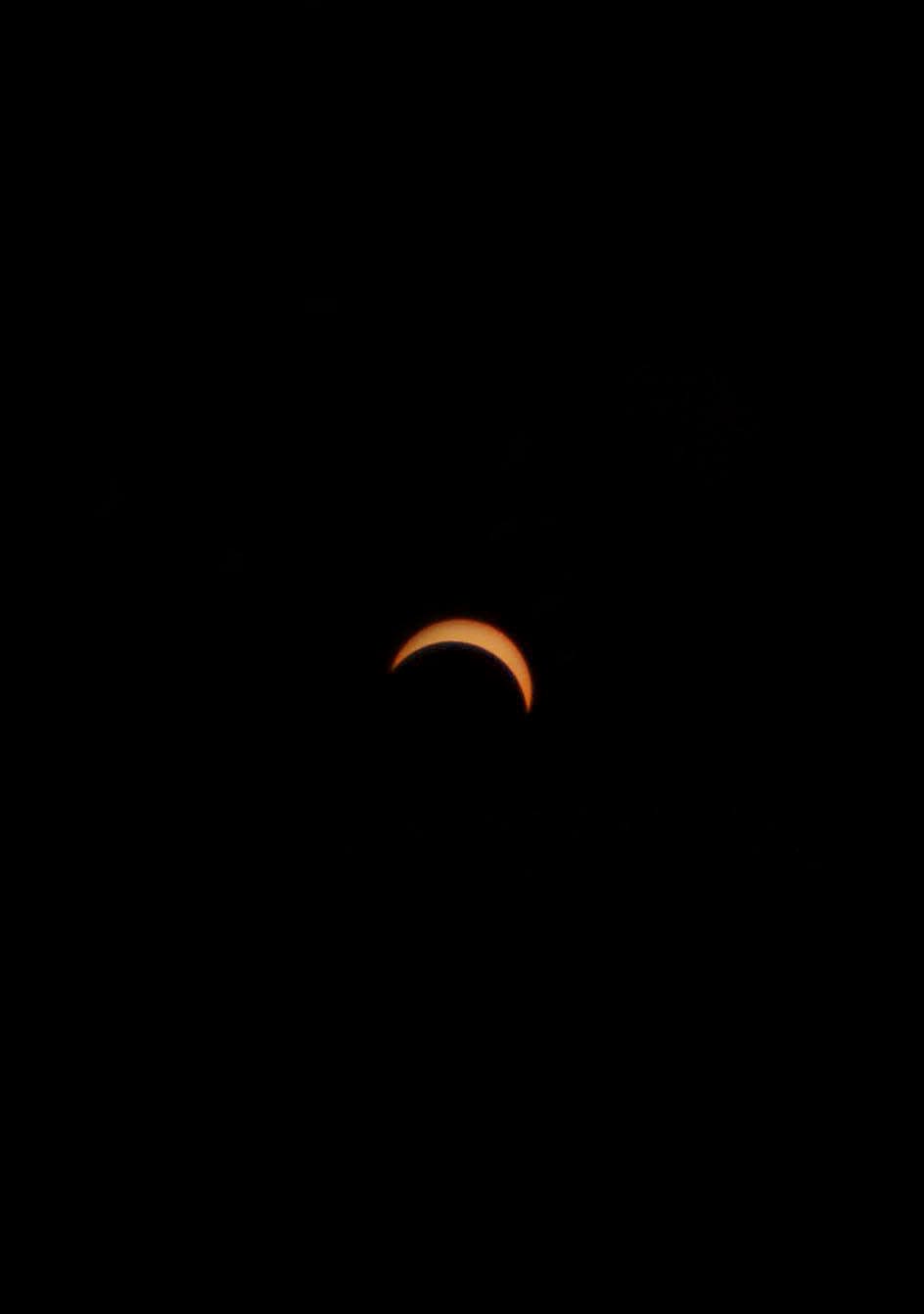 The solar eclipse in Northern Michigan reaches about its peak point at 86 percent coverage in Harbor Springs on Monday, April 8.