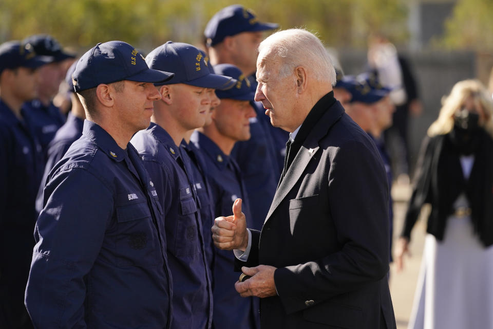 President Joe Biden speaks with members of the coast guard as he visits the United States Coast Guard Station Brant Point in Nantucket, Mass., Thursday, Nov. 25, 2021. (AP Photo/Carolyn Kaster)