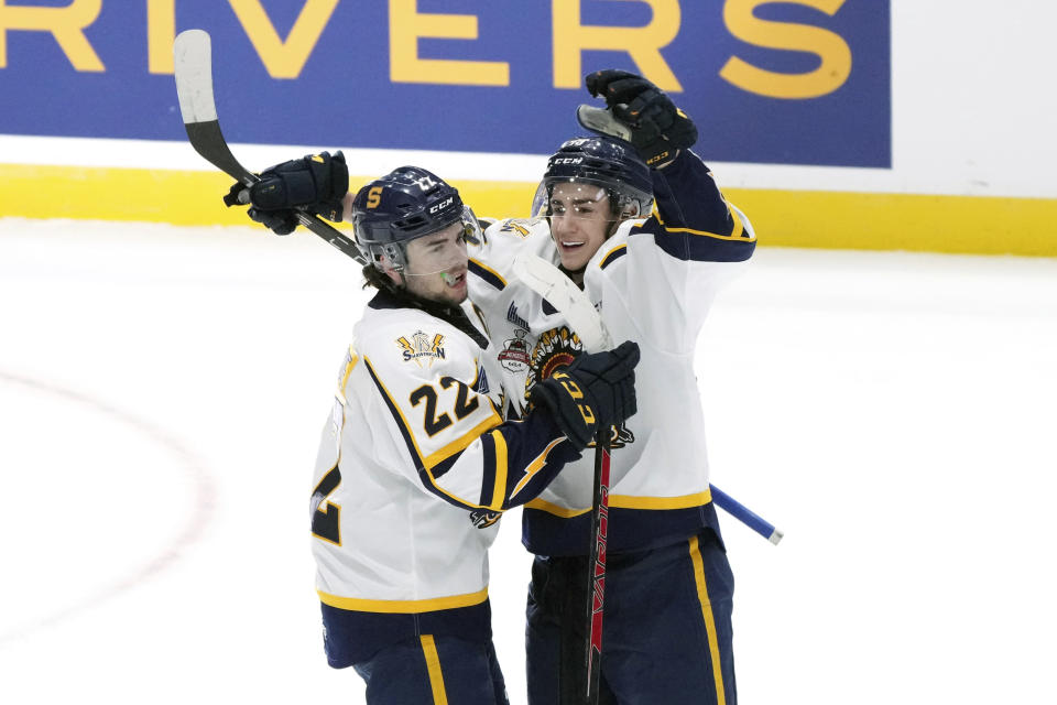 Shawinigan Cataractes' Jordan Tourigny, right, celebrates his goal with teammate Mavrik Bourque during the first period of the Memorial Cup hockey game against the Edmonton Oil Kings in Saint John, New Brunswick, Tuesday, June 21, 2022. (Darren Calabrese/The Canadian Press via AP)