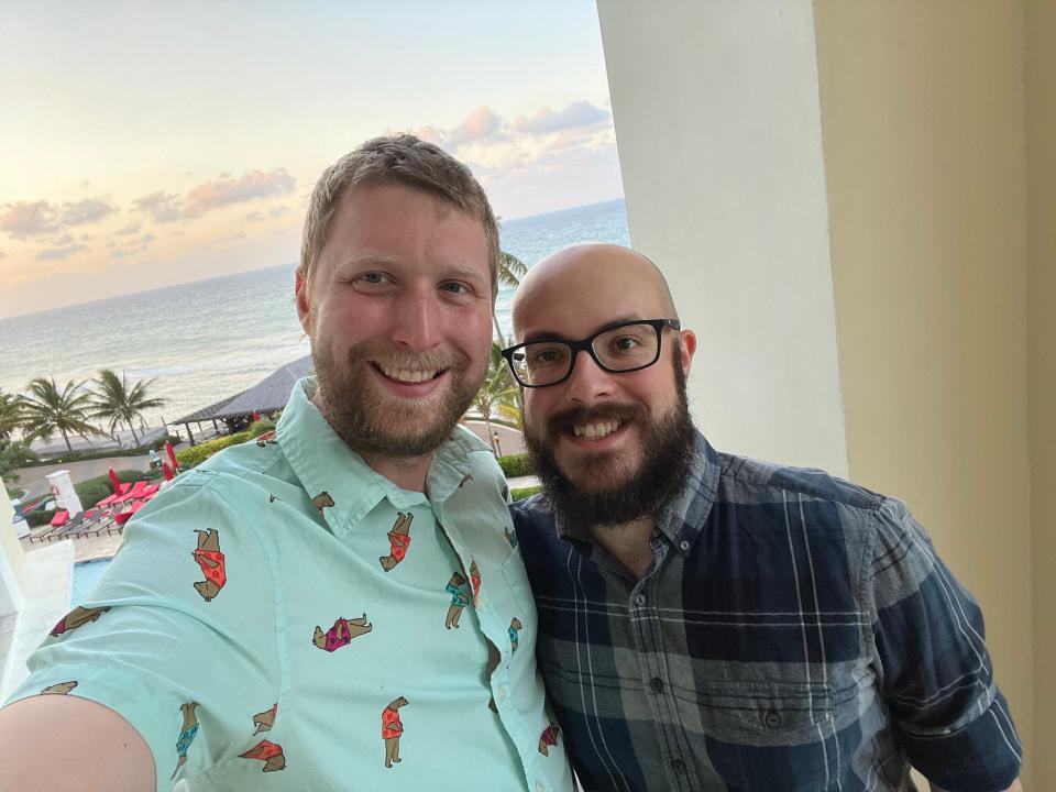 Timothy Moore and his husband posing for a selfie at Jewel Grande