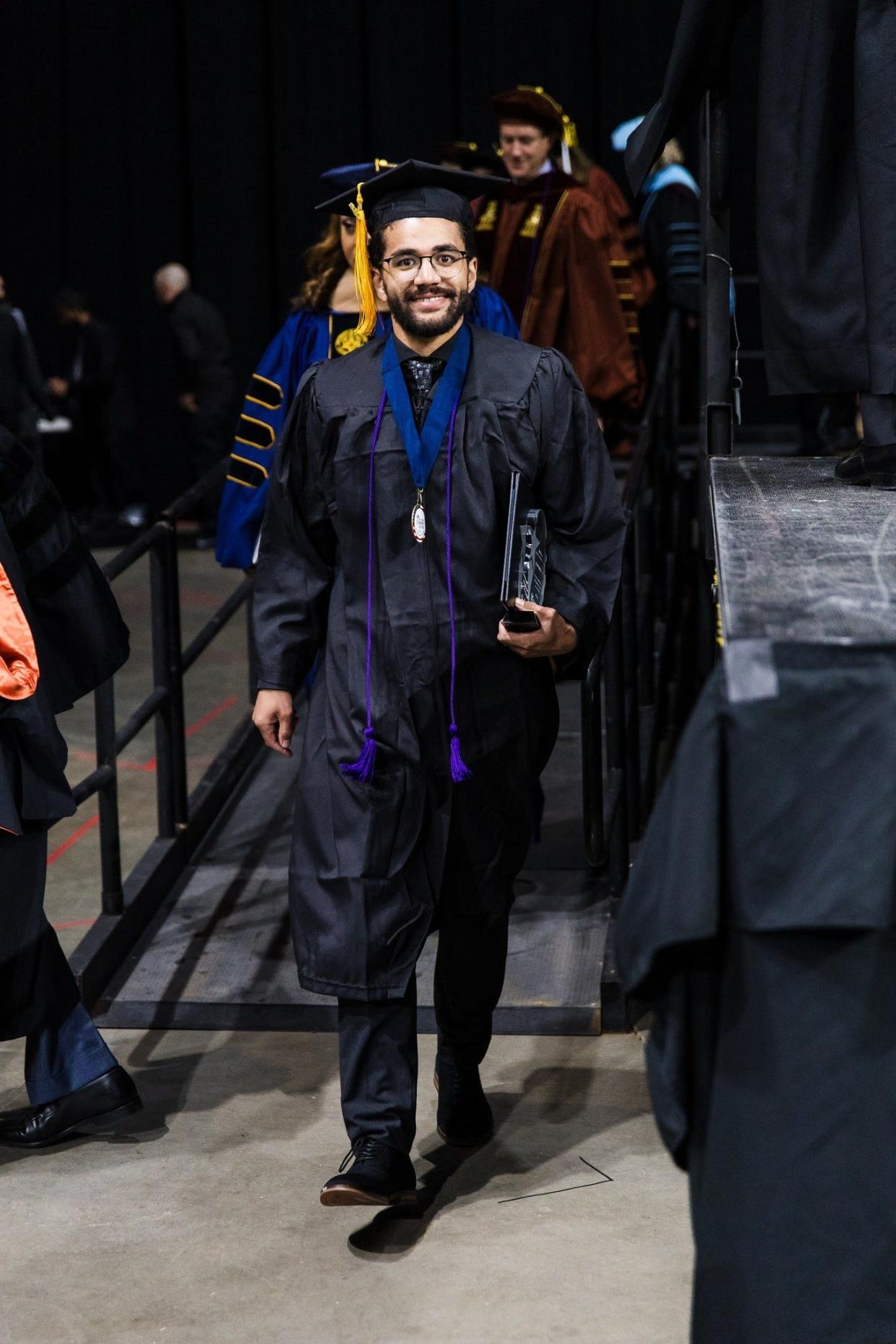 Julian Cotto, a father of two, received his associate degree of applied science in computer programming at Austin Community College's fall graduation. He also received the Chancellor’s Student Achievement Award.