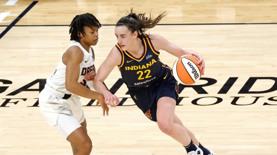 INDIANAPOLIS, IN – MAY 09: Indiana Fever guard Caitlin Clark (22) drives to the basket against <a class="link " href="https://sports.yahoo.com/wnba/teams/atlanta/" data-i13n="sec:content-canvas;subsec:anchor_text;elm:context_link" data-ylk="slk:Atlanta Dream;sec:content-canvas;subsec:anchor_text;elm:context_link;itc:0">Atlanta Dream</a> guard Destanni Henderson (33) during a WNBA preseason game on May 9, 2024, at Gainbridge Fieldhouse in Indianapolis, Indiana. (Photo by Brian Spurlock/Icon Sportswire via Getty Images)