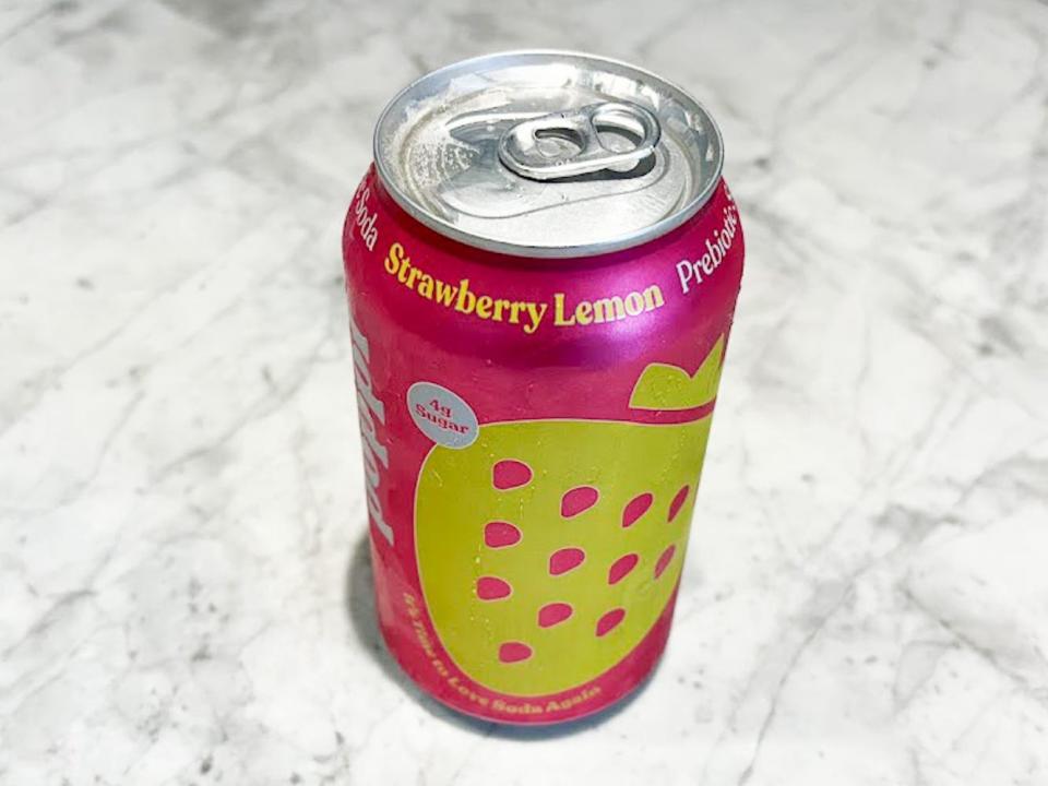 A can of strawberry-lemon Poppi on a countertop.