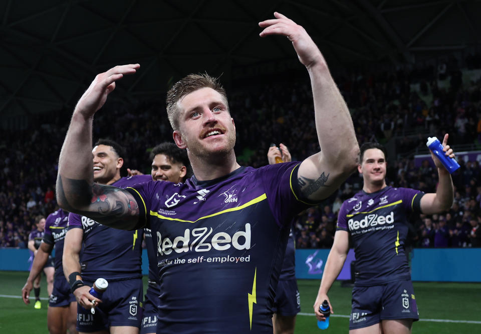 MELBOURNE, AUSTRALIA - SEPTEMBER 27:  Cameron Munster of the Storm celebrates winningthe NRL Preliminary Final match between the Melbourne Storm and Sydney Roosters at AAMI Park on September 27, 2024 in Melbourne, Australia. (Photo by Cameron Spencer/Getty Images)