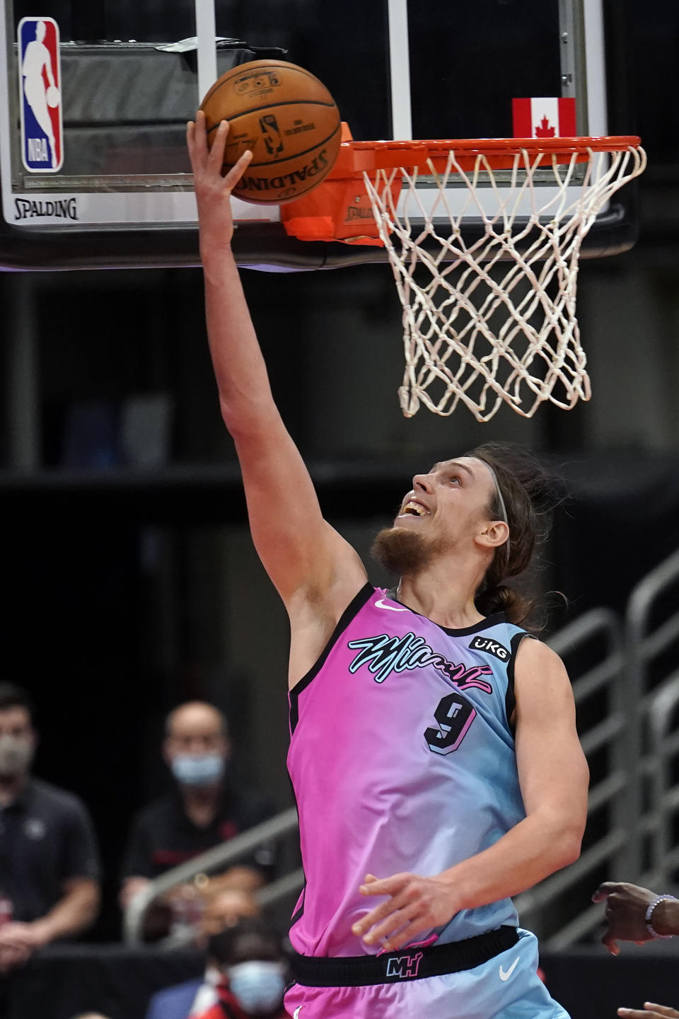 Miami Heat forward Kelly Olynyk (9) goes for a layup against the Toronto Raptors during the second half of an NBA basketball game Wednesday, Jan. 20, 2021, in Tampa, Fla. (AP Photo/Chris O'Meara)