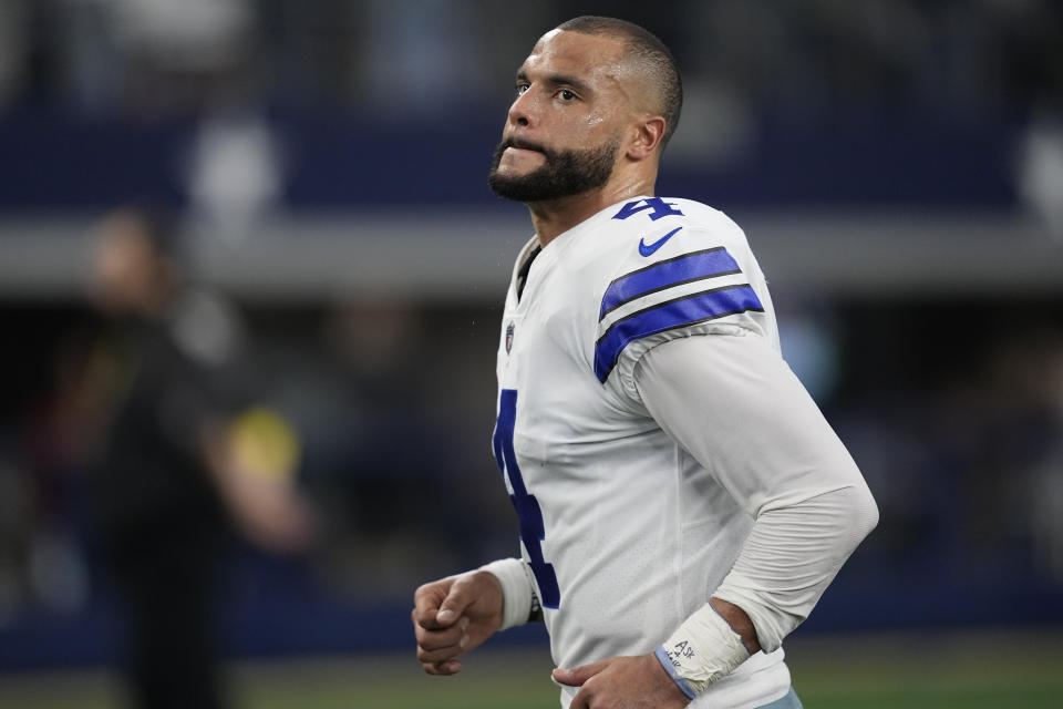 Dallas Cowboys quarterback Dak Prescott (4) runs off the field after defeating the Houston Texans on Dec. 11, 2022, in Arlington, Texas. (AP Photo/Tony Gutierrez)