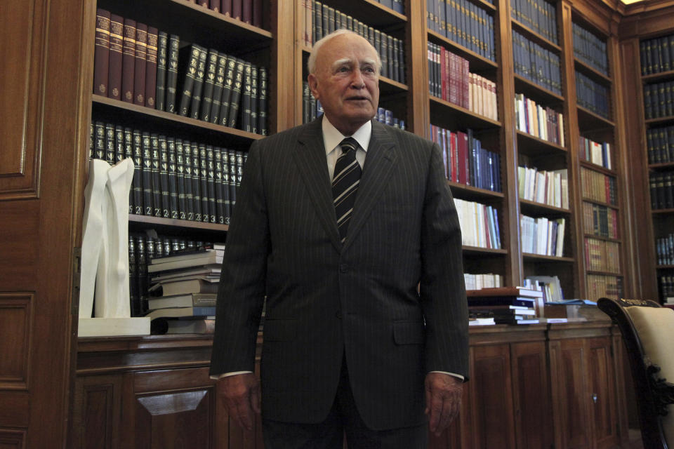 FILE - Greek President Karolos Papoulias waits in his office for Parliament Speaker Philippos Petsalnikos to present him with the final results of Greece's national elections, in Athens on Monday, May 7, 2012. Papoulias, a former President of Greece, has died at the age of 92, Greece's state news agency ANA reported on Sunday, Dec. 26, 2021. Papoulias, a lawyer by training, was close to socialist leader Andreas Papandreou and served in all his governments from 1981-1996, all in foreign affairs positions, ending as Foreign Minister. (AP Photo/Petros Giannakouris, Pool,File)