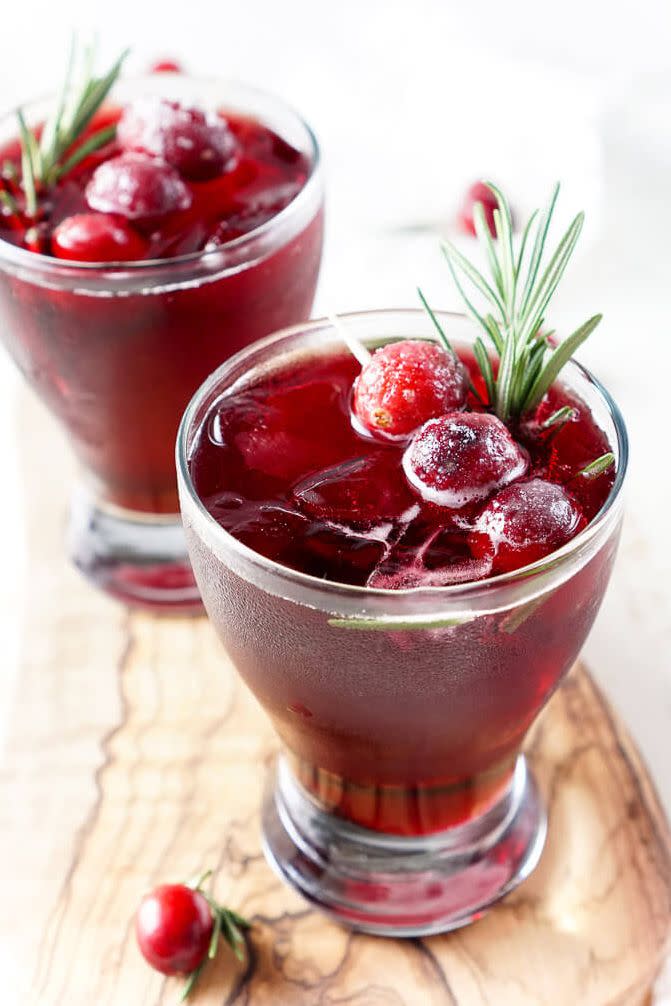 <p>Give these fruity drinks (alcoholic or not) a holiday touch with <a href="https://www.goodhousekeeping.com/holidays/thanksgiving-ideas/g22854655/cranberry-recipes/" rel="nofollow noopener" target="_blank" data-ylk="slk:fresh cranberries;elm:context_link;itc:0;sec:content-canvas" class="link ">fresh cranberries</a> and a sprig of rosemary. </p><p><em><a href="https://www.sugarandsoul.co/cranberry-cooler-recipe/" rel="nofollow noopener" target="_blank" data-ylk="slk:Get the recipe from Sugar & Soul Co. »;elm:context_link;itc:0;sec:content-canvas" class="link ">Get the recipe from Sugar & Soul Co. »</a></em></p>