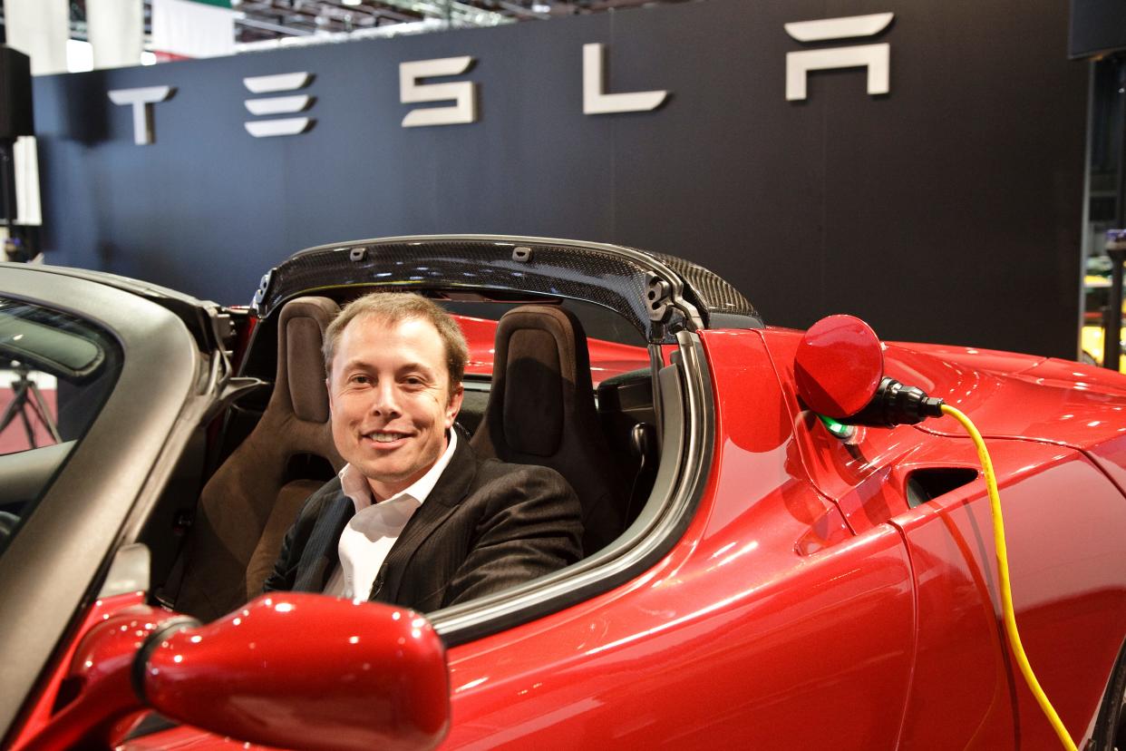 Elon Musk in a Tesla Roadster.