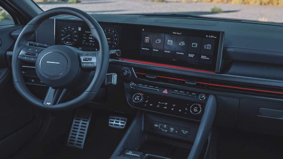 2024 hyundai sonata n line interior with big screens and black leather steering wheel