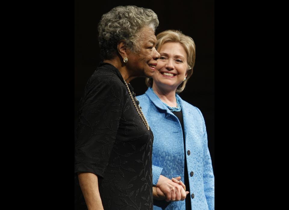 Hillary Rodham Clinton holds the hand of Dr. Maya Angelou during a conversation in front of an audience at Wake Forest University.  
